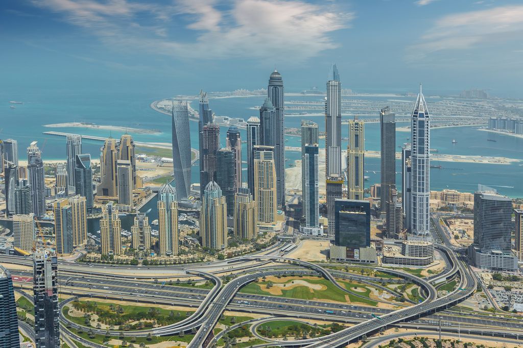 An aerial view of buildings and construction projects in Dubai.