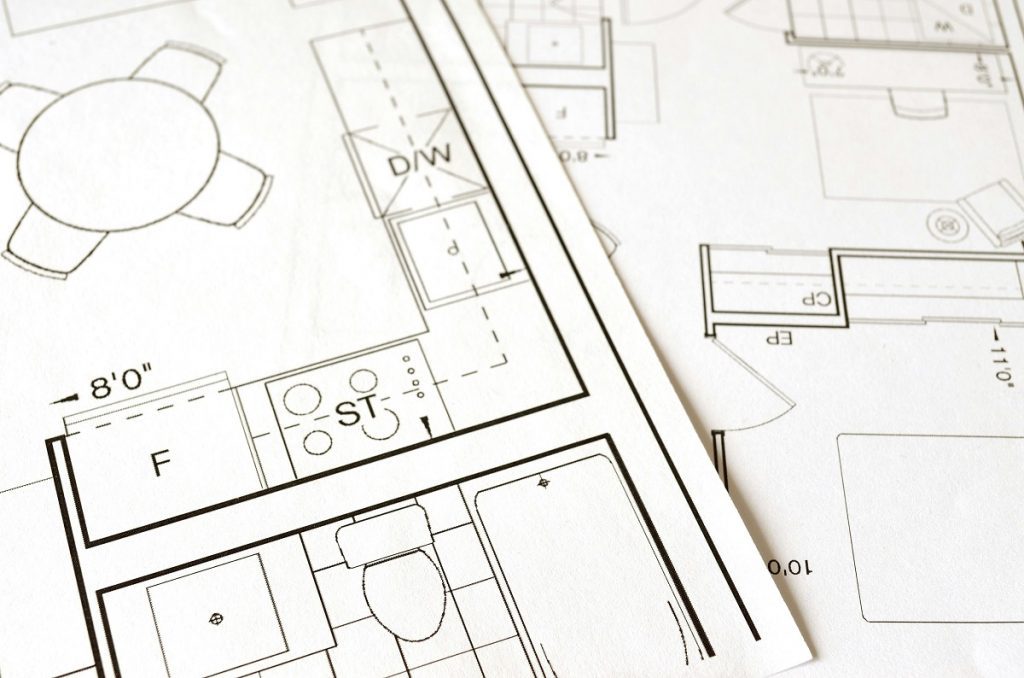 Close-up of architectural floor plans with technical symbols and layout details